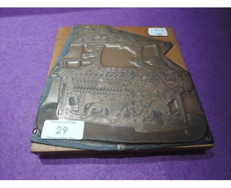 A vintage copper etched printers block depicting early industrial machinery