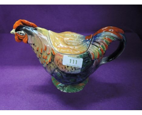 A vintage novelty teapot modelled as a Rooster, reg num 81073CONDITION REPORTAge related crazing apears all over this piece