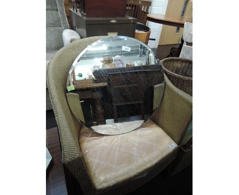 A vintage frameless wall mirror 