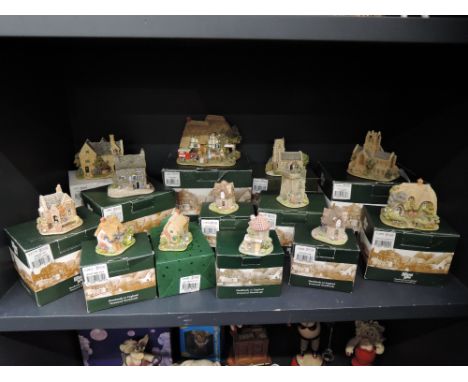 A shelf of Liliput lane studies including Snuggledown, Strawberry Fields, Tying The Knot etc, all boxed