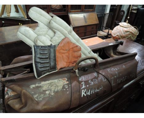A vintage cricket bag and contents