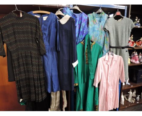 Eight vintage items of clothing, mostly 1960s in a variety of styles and fabrics, some damage and age related wear to some it