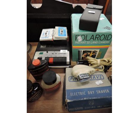 A selection of vintage items including Polariod 