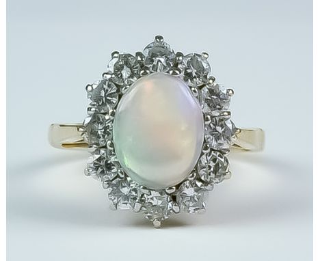 A Opal and Diamond Ring, Modern, 18ct yellow gold set with a central opal, 8mm x 10mm, surrounded by twelve brilliant cut whi