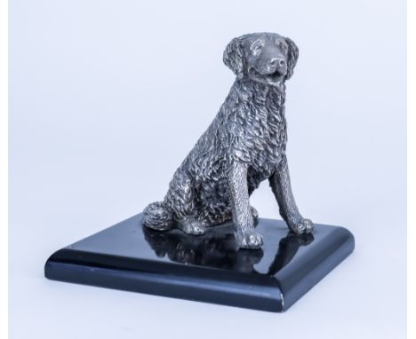 A 20th Century Cast Silvery Metal Model of a Seated Retriever, on rectangular ebonised base, 5ins high