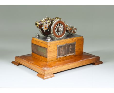 A Mahogany, Plated and Gilt Metal Model of the Zamzama Gun, 20th Century, in glazed hardwood display case, 12ins x 8.5ins x 1