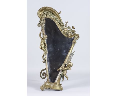 A Continental Brass Dressing Table Mirror Cast with Putti, on a harp shaped framed, late 19th Century, 11ins wide x 20ins hig