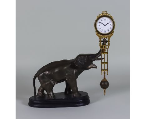 A Continental Gilt Brass and Bronzed Spelter "Mystery" Timepiece, modelled in the form of a patinated spelter standing elepha