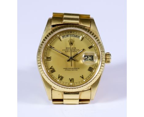 A Rolex Oyster Perpetual Day Date Chronometer, 1987, 18ct gold, Serial No. R221334, Model No. 18038, 36mm diameter case, the 