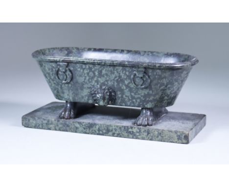An Italian Serpentine Marble Model of a Roman Bath, 19th Century, the sides carved with lion masks and faux ring handles, on 
