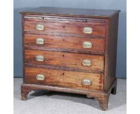 A George III Mahogany Chest, with moulded edge to top and crossbanded, fitted with a brushing slide and four long graduated d