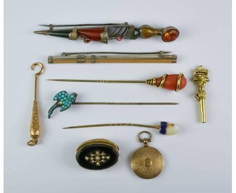 A Small Selection of Pins and Bar Brooches, Late 19th / Early 20th Century, comprising - two yellow gem set pins, a gem set a