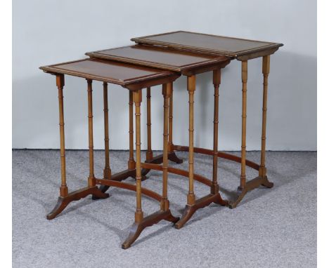 A Nest of Three Mahogany Rectangular Occasional Tables of "George III" Design, on slender turned legs and bracket feet, 22ins