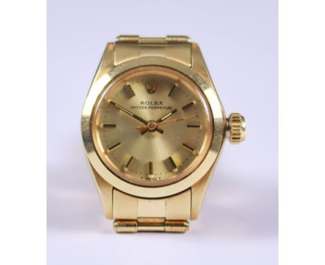 A Lady's Rolex Oyster Perpetual Automatic Wristwatch, 1979, 14ct gold case, Serial No. 3749453, the gold dial with gold baton