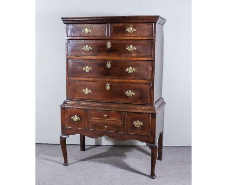 An 18th Century Oak Chest on Stand, with moulded edge to top, fitted two short and three long dawers, base fitted one drawer 