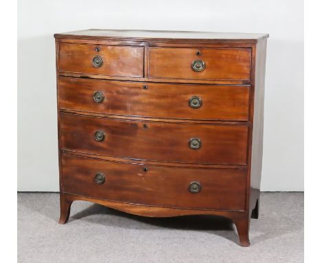 A George III Mahogany Bow Front Chest, with reeded edge to top, fitted two short and three long drawers, with shaped apron an