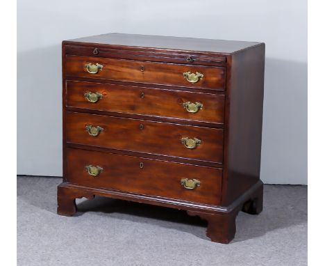 A George III Mahogany Chest, with moulded edge to top, fitted with a brushing slide and four long graduated drawers, on brack