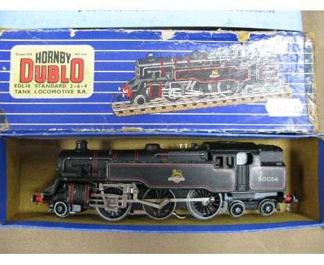 A Hornby Dublo Three Rail 0-6-2 Standard Tank R/No 80054, overall good, boxed, repair label and box tatty with top insert.