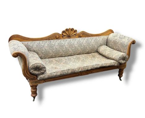 A Victorian mahogany scroll end sofa with carved top rail on turned legs, 88 x 193 x 58cm