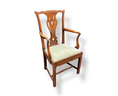 A George III fruitwood elbow chair with pierced vase shaped splat and drop in seat 106cm highDeep scratches to the rear of th