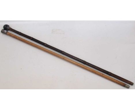 A walking stick with silver mount by Brigg and banded agate pommel, 94cm, and another silvercapped walking cane, 92cm