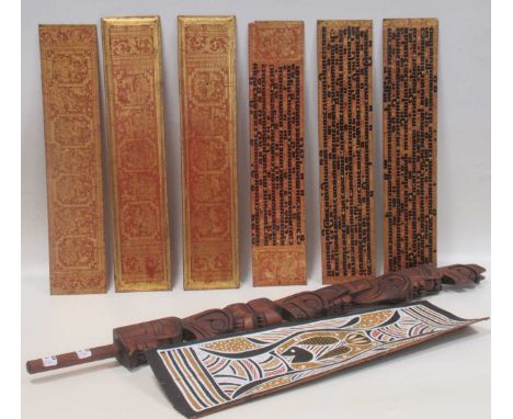 Six lacquered gilt Burmese panels with religious text and figures, 53 x 11cm; a native Australian/Aboriginal bark fish painte