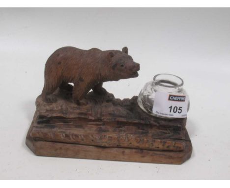 A Black Forest inkwell with standing bear and glass inkwell, 8 x 14cm