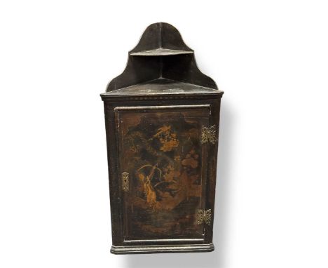 18th century and later, an ebonised corner cupboard with single door below small shaped shelf. The door front with 'japanned'