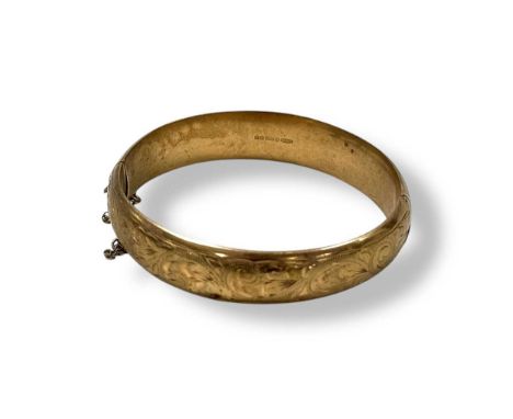 A hallmarked 9ct gold bangle, weight 14.1g