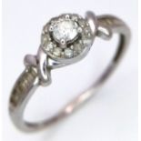 A 10K White Gold Diamond Ring. 0.33ctw of round and baguette cut diamonds. Comes with