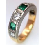 An 18K Yellow Gold (tested) Diamond and Emerald Band Ring. 0.60ctw of brilliant round cut diamonds