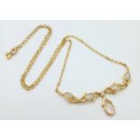 A Gorgeous Italian 18K Gold and Opal Lavaliere Necklace. Five opal cabochons with excellent colour-