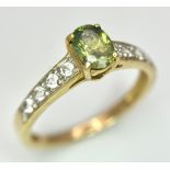 Beautiful 9 CARAT GOLD and PERIDOT RING. Nicely set,having an oval cut PERIDOT mounted to top with