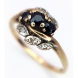 A Vintage 9K Yellow Gold Diamond and Sapphire Crossover Ring. Size N 1/2. 2g.