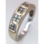 An 18K White Gold (tested) Diamond Ring. 20 princess cut diamonds - 0.50ctw. Size K. 3.6g