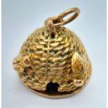 A 9K YELOW GOLD BEEHIVE CHARM WHICH OPENS AND REVEALS THE WORDS "YOU ARE MY QUEEN". 7.7G TOTAL