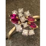 A Fabulous 18 CARAT GOLD DIAMOND and RUBY RING. (9 DIAMONDS & 4 RUBIES) 3.75 grams. Size P 1/2.