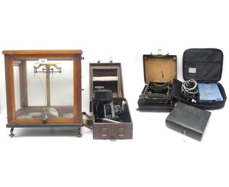 Cased laboratory scales by Bunge of Hamburg, a Mitsubishi projector in soft case, a small Victorian correspondence case in di