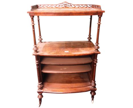 A Victorian burr walnut veneered open bookcase/music cabinet with pierced gallery top over open tier over open shelves separa
