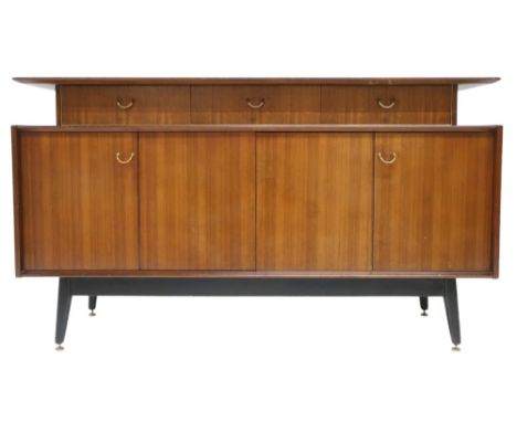 A MID 20TH CENTURY G PLAN E-GOMME LIBRENZA DINING SUITEComprising Tola sideboard with three short drawers over pair of concer