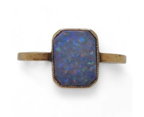 A yellow metal ring set with an opal, size J1/2, weight 1gms Condition Report:Available upon request