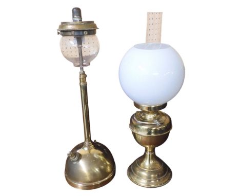 A lot comprising a late 19th century brass based oil lamp with opaque glass shade, 52cm high and another brass based lamp, 54