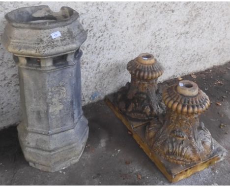 A lot comprising a Victorian stoneware octagonal chimney pot, 81cm high and a pair of stoneware acanthus leaf decorated plant