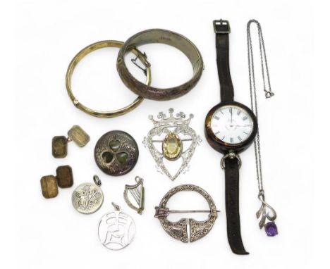 A silver bangle engraved with ivy leaves, a silver gilt example, a John Hart of Iona Luckenbooth set with citrine, a white me