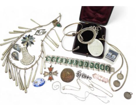 A large silver medallion, awarded for Classics at Wallace Hall Academy, a continental silver bangle with ram's head terminals