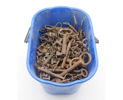 A large quantity of antique iron keys, of varying scale Condition Report:Available upon request
