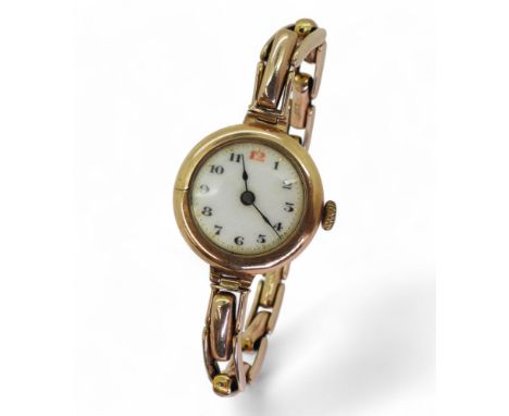A 9ct gold ladies vintage watch and strap, weight all together including mechanism weight 23gms Condition Report:Available up