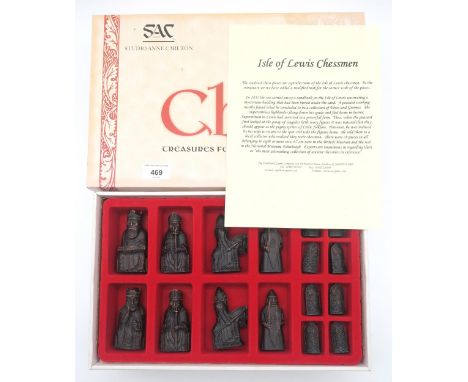 A Lewis Chessmen replica set, produced by S.A.C. Ltd., (Studio Anne Carlton, Hull, England), boxed; together with a further c