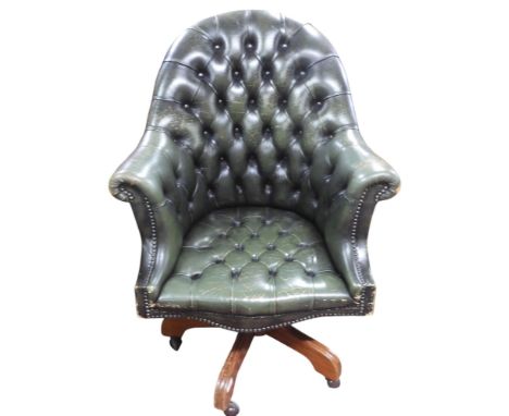 A 20th century forest green button upholstered Chesterfield style revolving desk chair, 109cm high Condition Report:Available