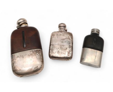 A George V silver hip flask, Birmingham 1931, maker's mark FEC?, and two plated examples, weighable silver 145gms (3) Conditi